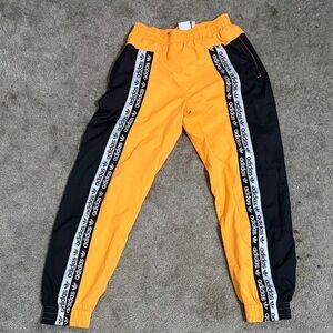 Adidas Orange and Black Joggers with Logo Stripes